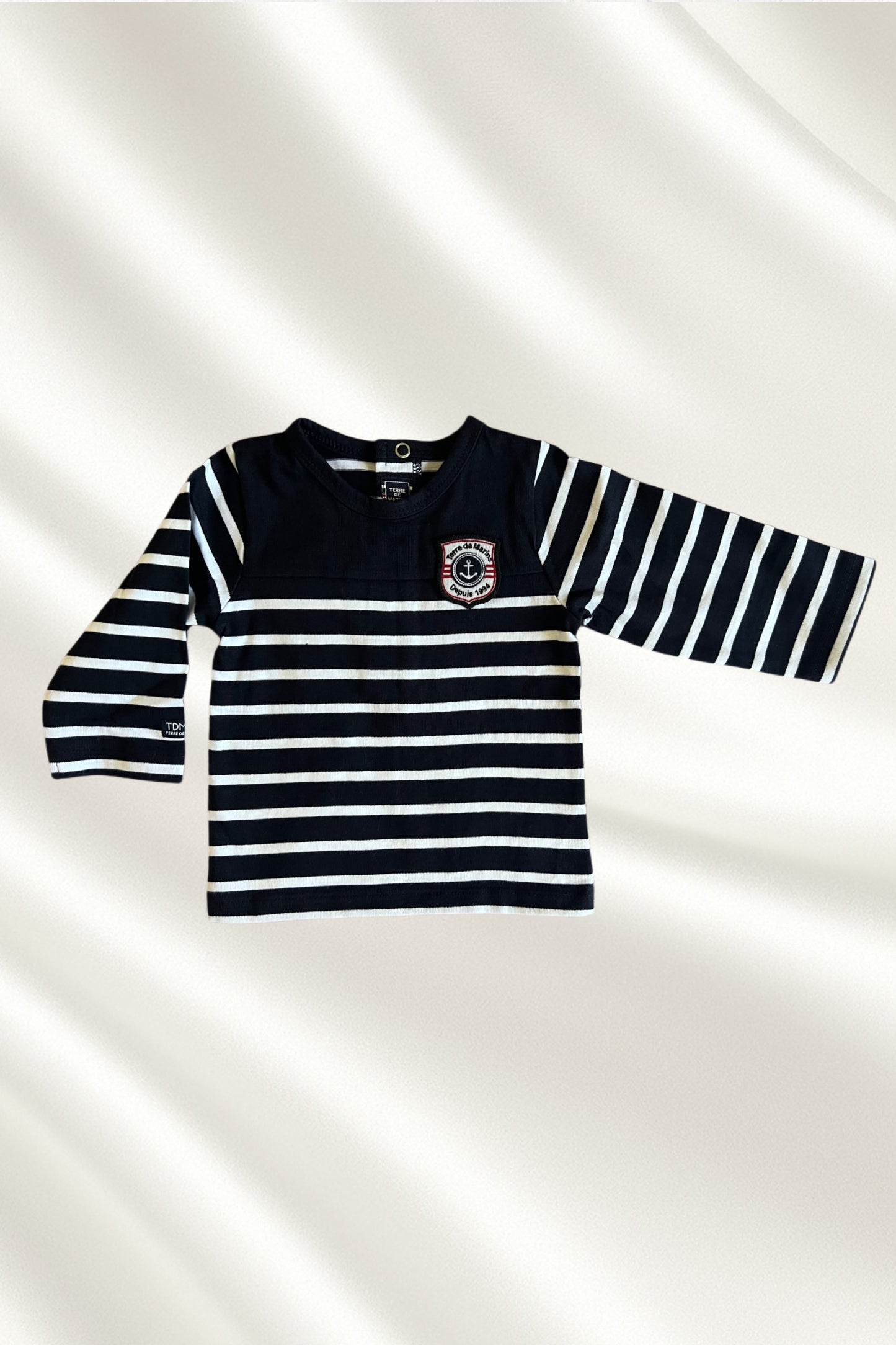 Pull rayé en blanc et bleu marine
